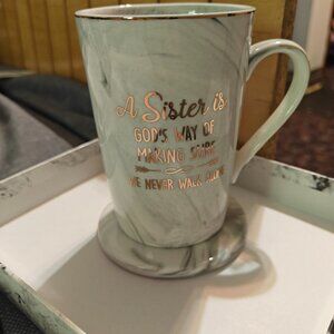 Sister's ceramic cup with long gold colored spoon. New.